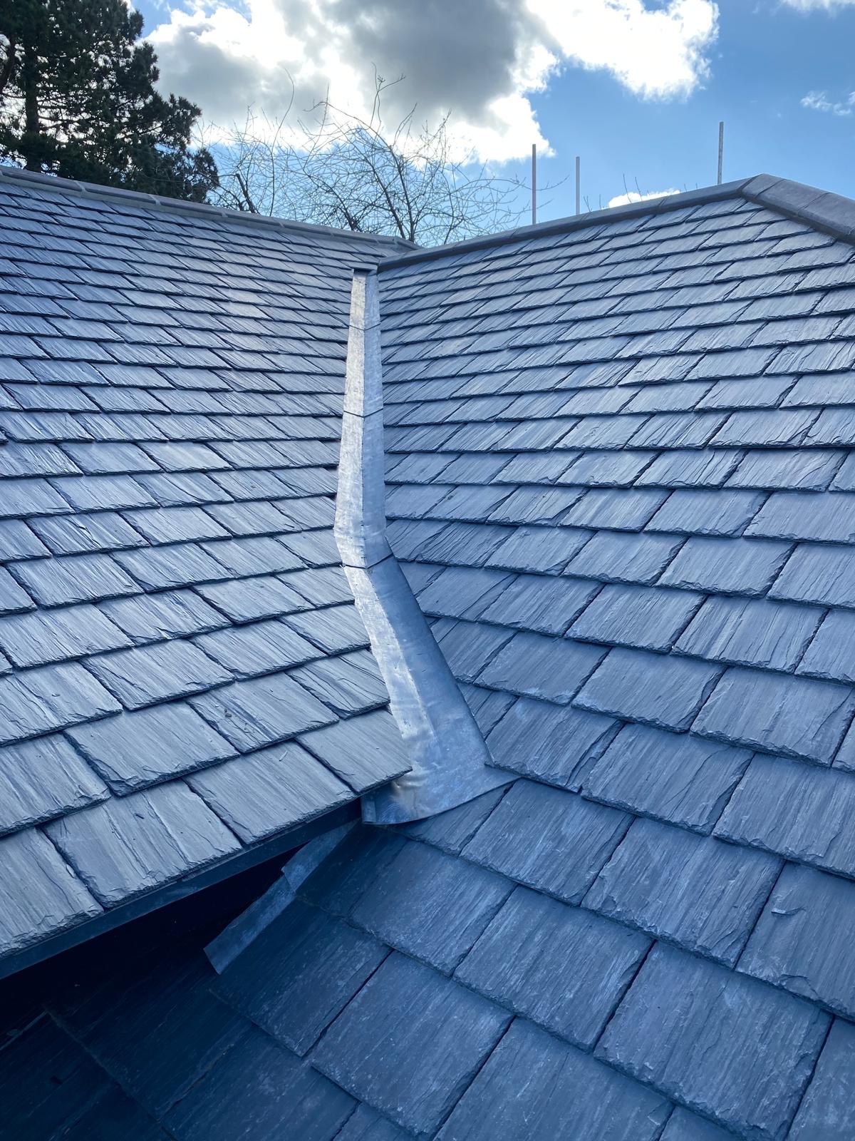Grey slate re-roof with dormer and valley detail