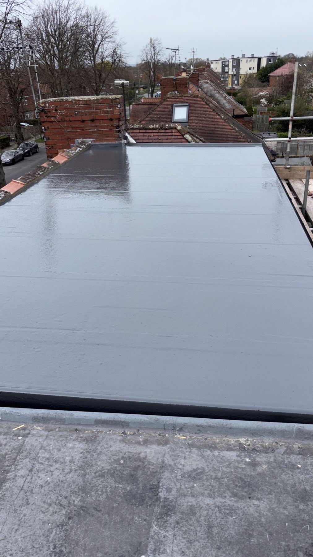 Grey EPDM single-ply rubber flat roof finished in one continuous sheet