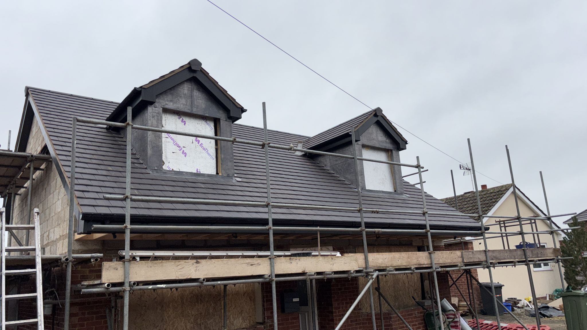 New dormer loft conversion in anthracite tile with lead cheeks, York