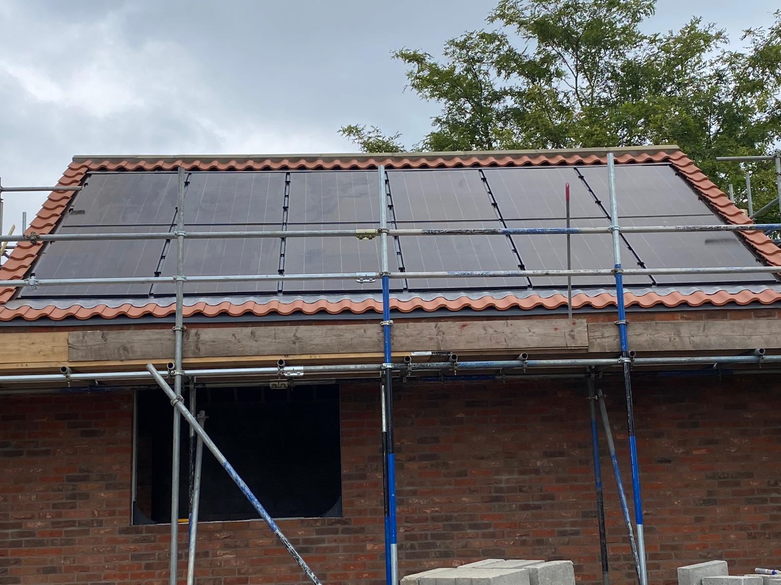 Solar panels installed on a red tile roof in York