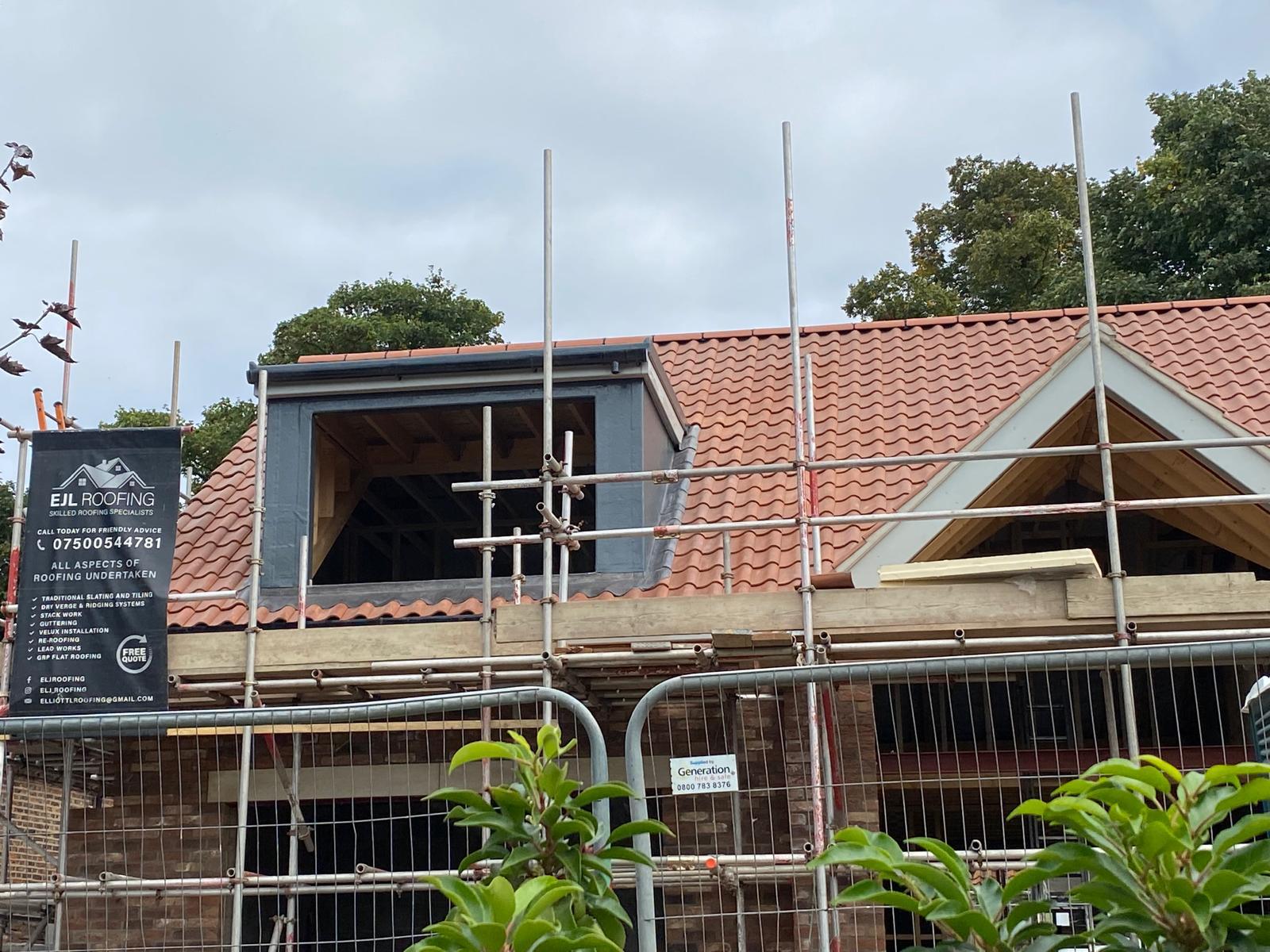 EJL Roofing banner on scaffolding during a dormer installation in York