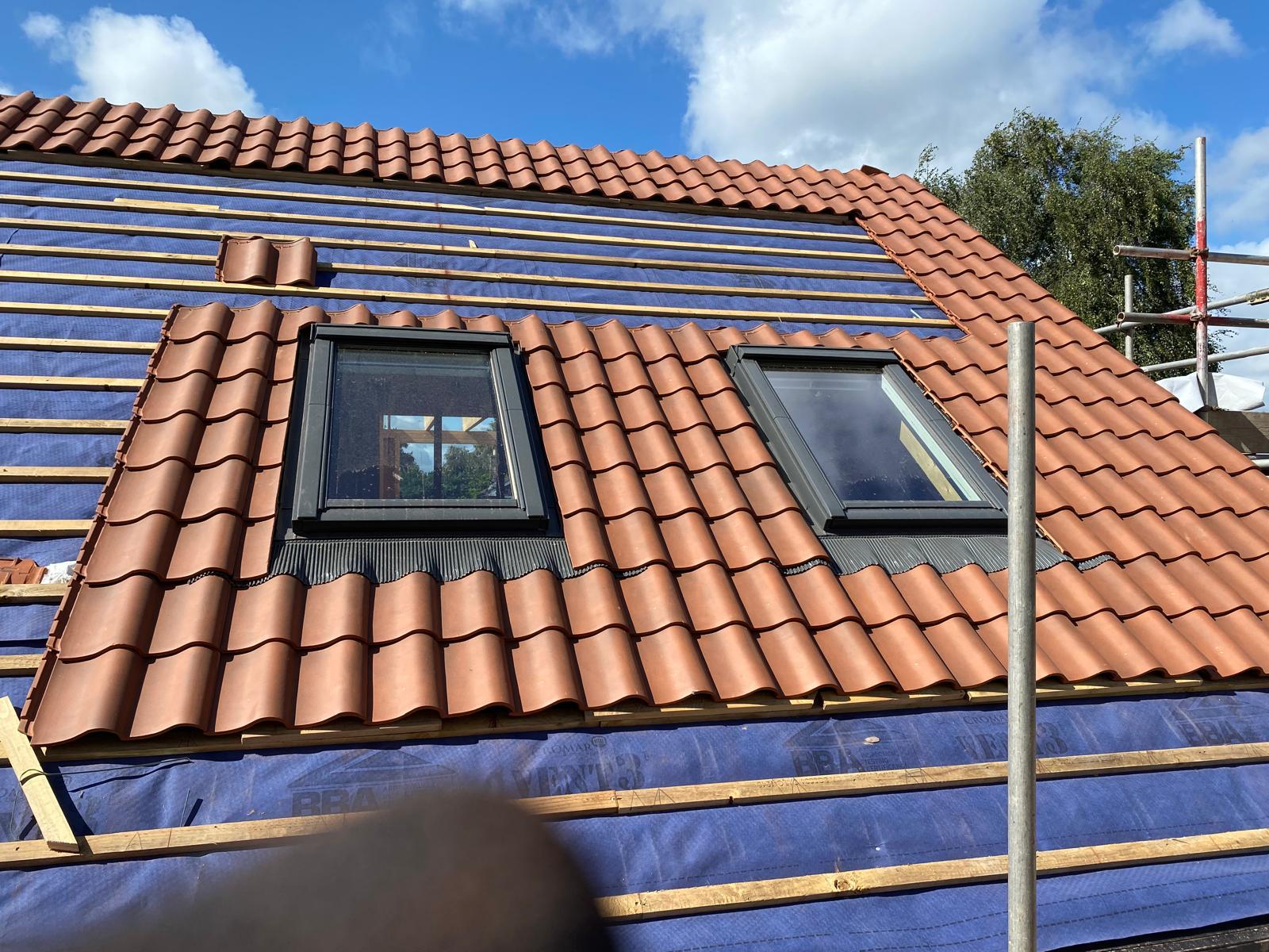 Roof slates fitted around a skylight window in Acomb